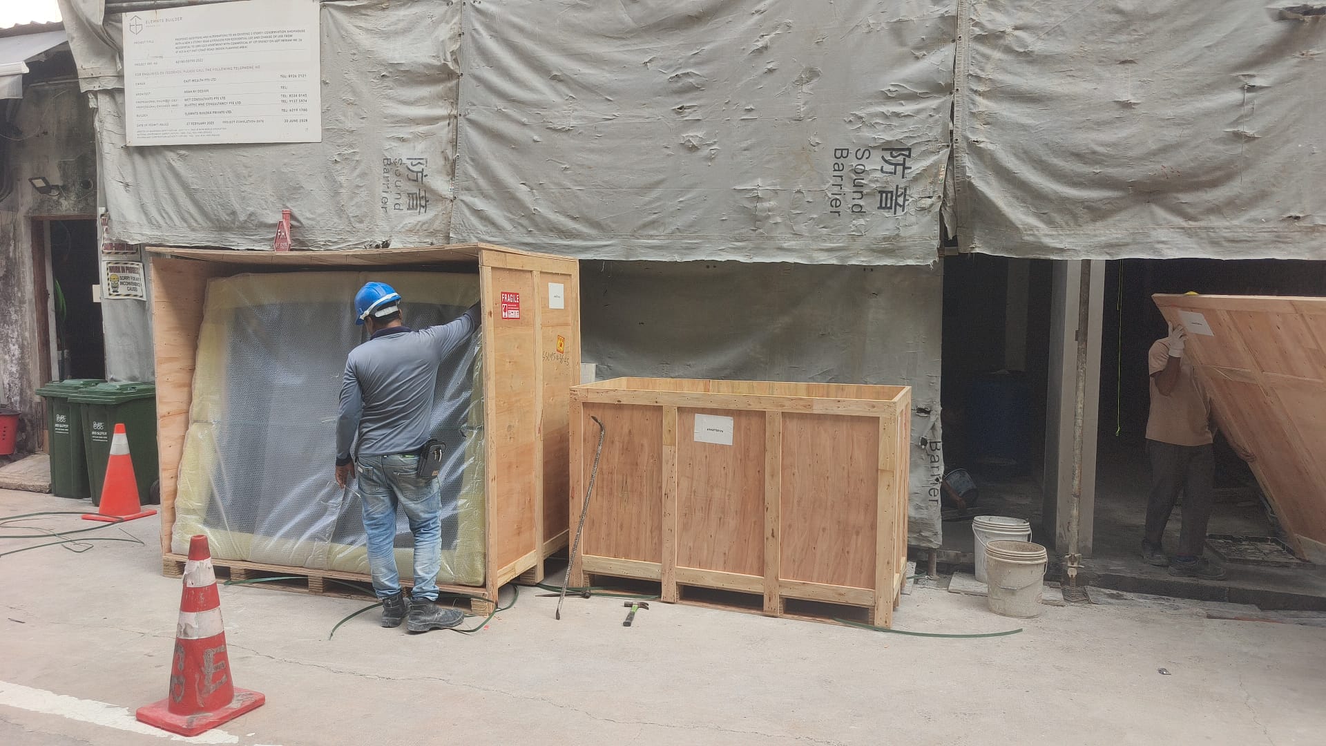 Crated glass and interior materials delivered to site