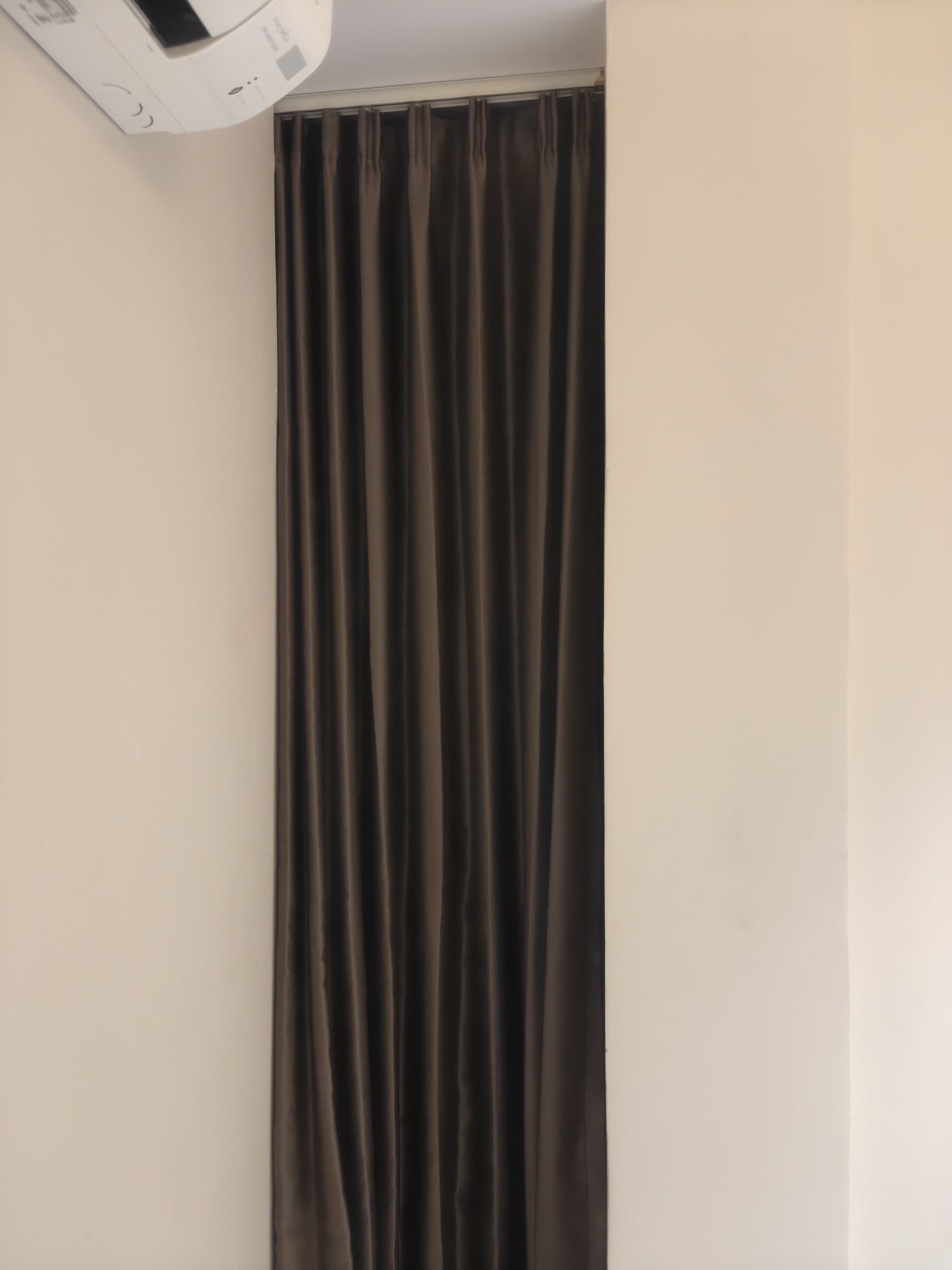 Floor-to-ceiling curtain installation